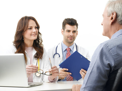 Medical team with elderly patient