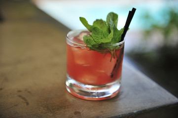 Cocktail with mint on the wooden table