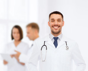 Fototapeta premium smiling male doctor with stethoscope