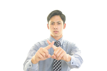 禁止の意思表示をするビジネスマン