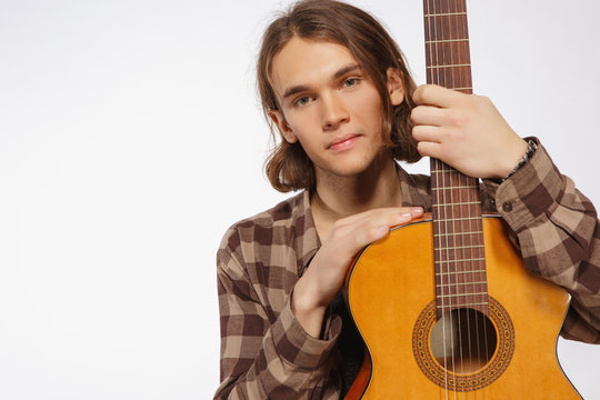 Young guitar player singing a song