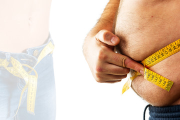 big man measuring his belly with a measuring tape
