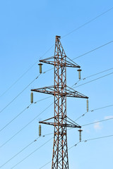 Electric lines pylon on blue sky background
