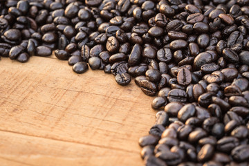 Coffee beans on wood background