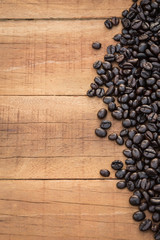 Coffee beans on wood background