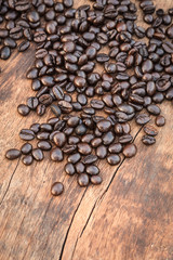 Coffee beans on wood background