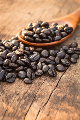 Coffee beans on wood background