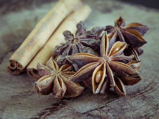cinnamon sticks and star anise on  wood background