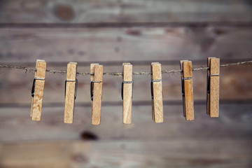 wooden clothespins on a rope.