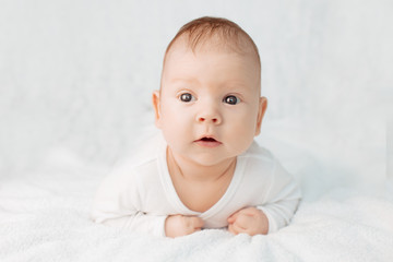 Beautiful cute laughing baby. Boy or girl on white. Little child