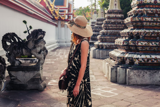 Woman exploring buddhist temple