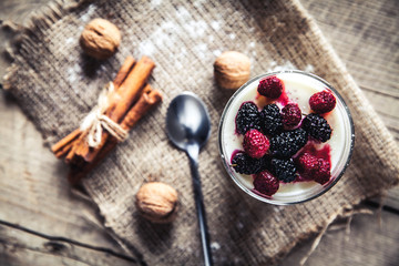 Obraz na płótnie Canvas Healthy breakfast - Dairy yogurt with raspberry, mulberry