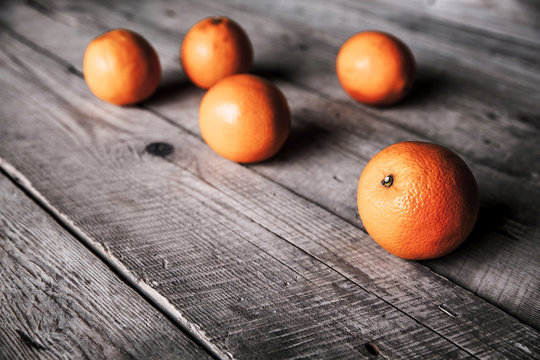 fresh, oranges on  a wooden background