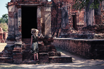 Woman exploring ancient ruins