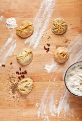 Uzbek national food manti on table with flour