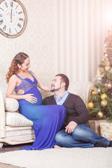 Pregnant couple sitting