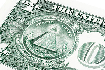 Stack of all seeing eye from a 1 dollar bill isolated on white