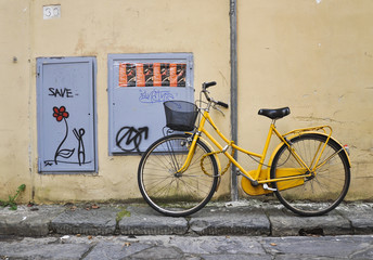 yellow bike in city street