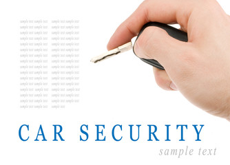 Hand holding car keys isolated on white background