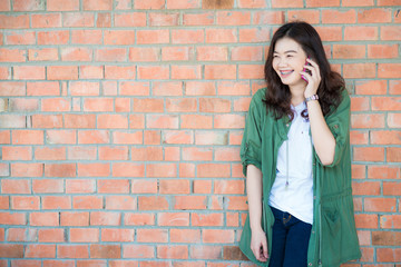 City lifestyle stylish hipster girl using a phone texting on sma
