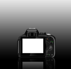 Digital SLR camera (dSLR) with a reflection on a table