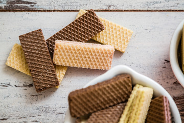 White and Black Wafer Biscuits on White Table
