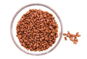 Rice cereal on the bowl on a white background seen from above