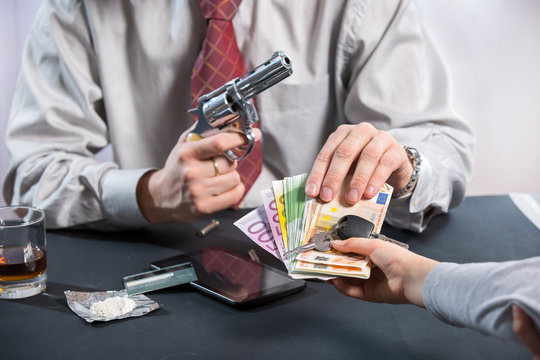 Loan shark with gun, money, drugs