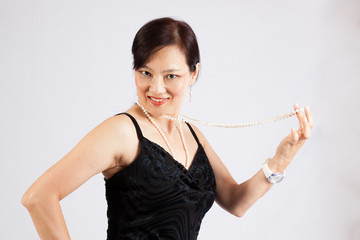 Asian woman looking at the camera with a smile