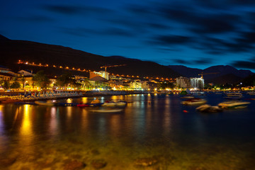 Naklejka na ściany i meble Night landscape of seaside town of Petrovac, Montenegro.