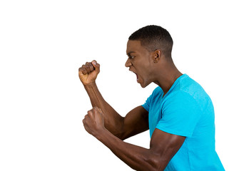  angry upset young man fists in air, open mouth yelling