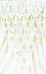 white satin folded pattern fabric art