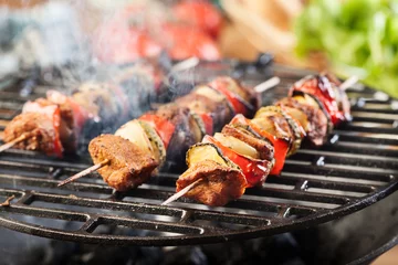 Wall murals Grill / Barbecue Grilling shashlik on barbecue grill
