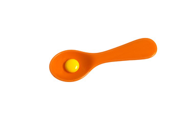 orange spoon with yellow tablet isolated