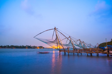 Fototapeta na wymiar Kochi chinese fishnets in twilight Kochi, Kerala. Fort Kochin, K