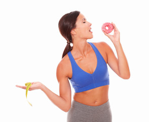 Fit young lady holding measuring tape