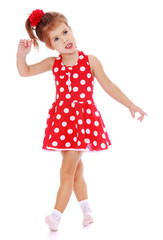 Charming little girl is going briskly.