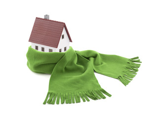 House wrapped in a scarf isolated on white