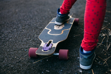 longboard and sport shoes closeup