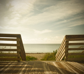 Wooden deck with fence overlooking the ocean