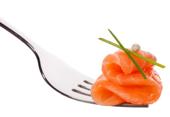 Salmon piece on fork isolated on white background cutout