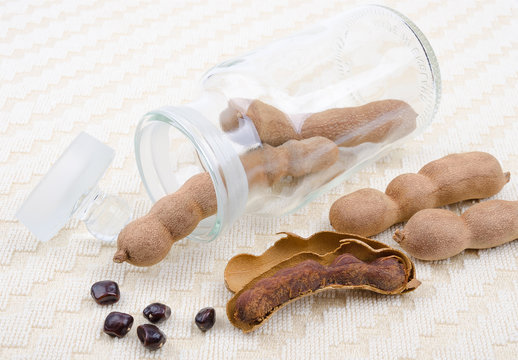 Dried Tamarind Fruits With Seeds In A Glass On Cotton