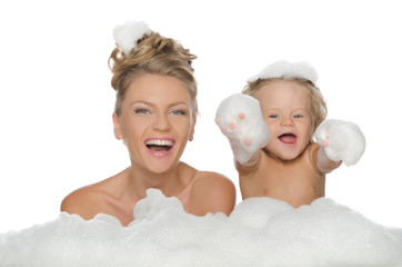 Happy mother with her daughter and soap foam