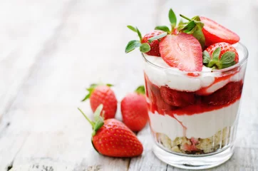 Fotobehang layered dessert with strawberries, biscuit cake and cream cheese © nata_vkusidey