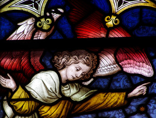 Pointing angel in stained glass