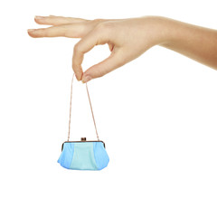 Small female handbag in big hand isolated on white