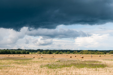 Fototapeta na wymiar Landcape with dramatic rainy clouds.