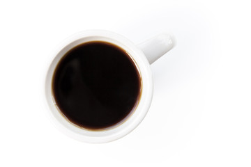 White cup with black coffee stands on the table