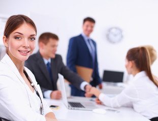 Business people shaking hands, finishing up a meeting