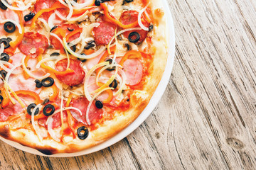 pizza on wooden background